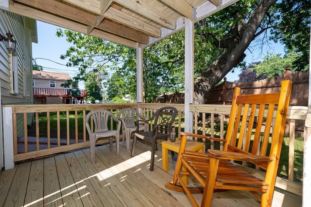 25 Agate Avenue Worcester, MA 01604 - Photo 30 of 34 a view of a balcony with chairs and wooden floor