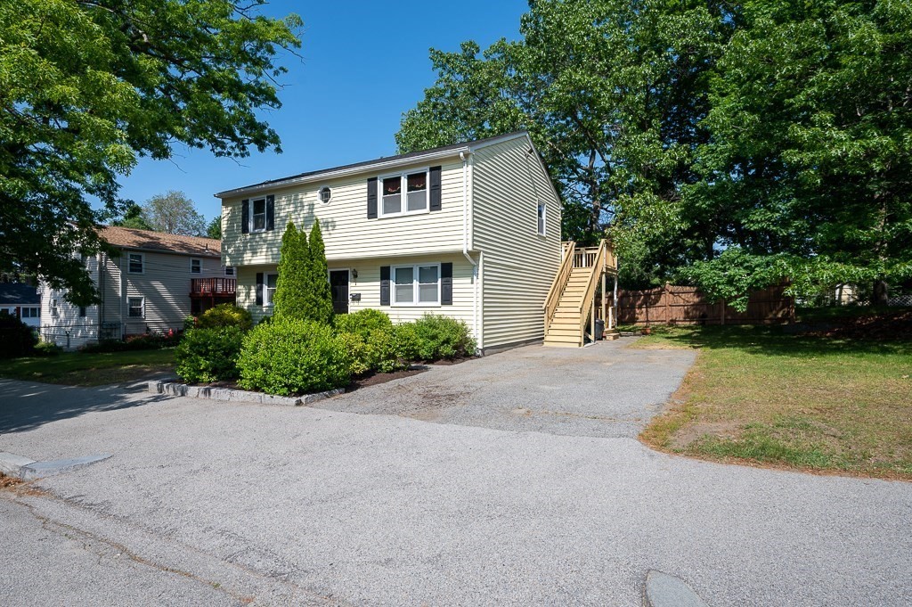 25 Agate Avenue Worcester, MA 01604 - Photo 3 of 34 a view of a white house with a yard and plants