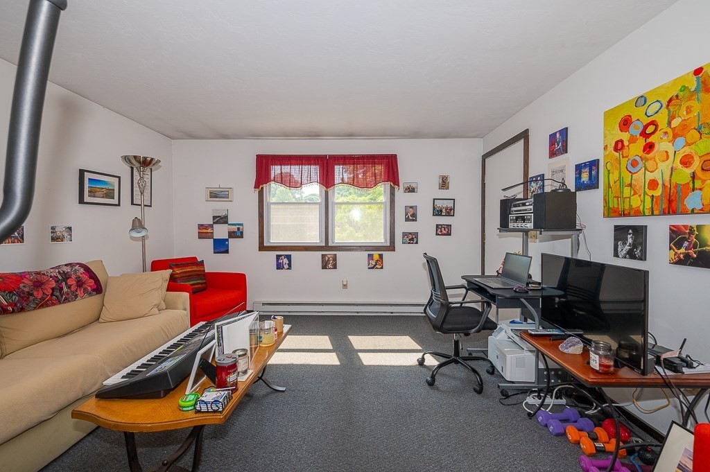 25 Agate Avenue Worcester, MA 01604 - Photo 7 of 34 a living room with furniture a flat screen tv and a window