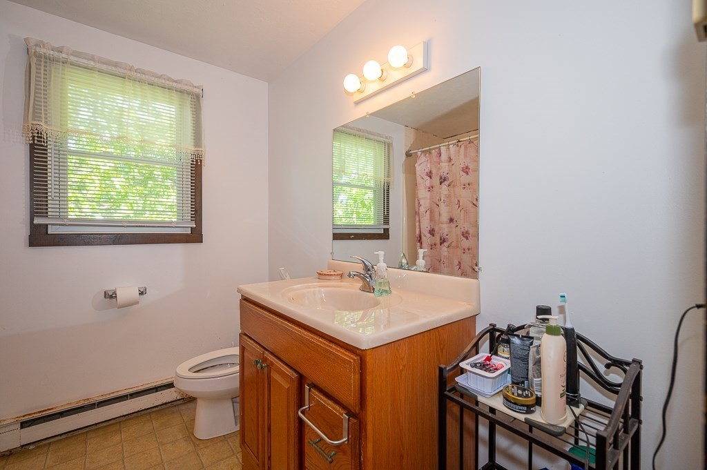 25 Agate Avenue Worcester, MA 01604 - Photo 9 of 34 a bathroom with a sink toilet and a mirror