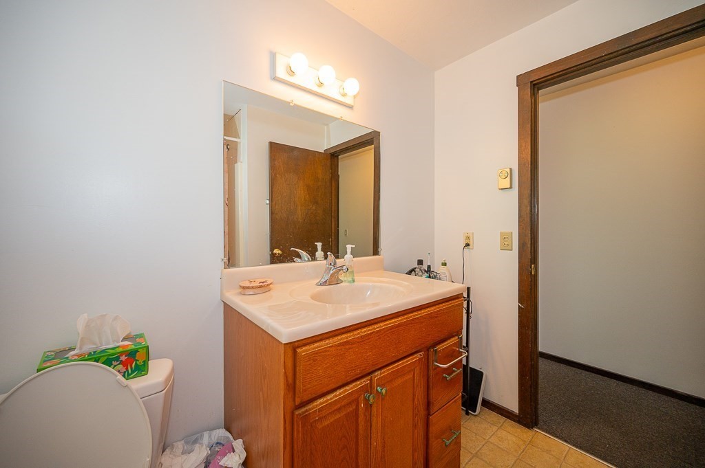25 Agate Avenue Worcester, MA 01604 - Photo 10 of 34 a bathroom with a sink vanity and a mirror