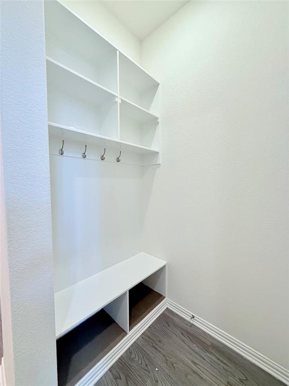 1336 Morning View Road Georgetown, TX 78628 - Photo 9 of 40 Functional mudroom featuring built-in shelving, a convenient bench, and sturdy hooks for everyday organization.