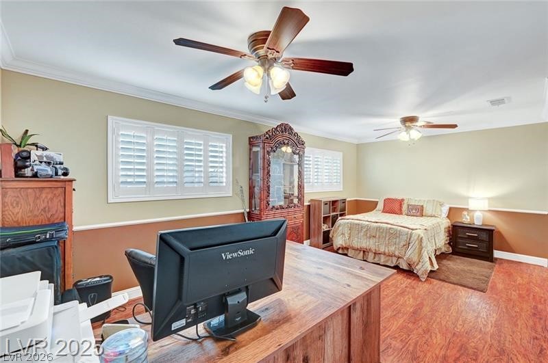 2410 Doherty Way Henderson, NV 89014 - Photo 37 of 63 Bedroom with wood finished floors, crown molding, baseboards, and a ceiling fan