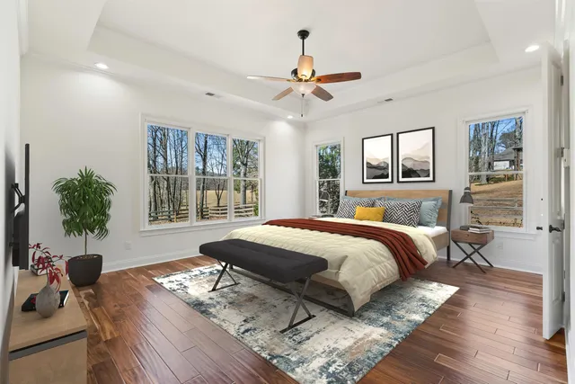 a spacious bathroom with a sink and a mirror