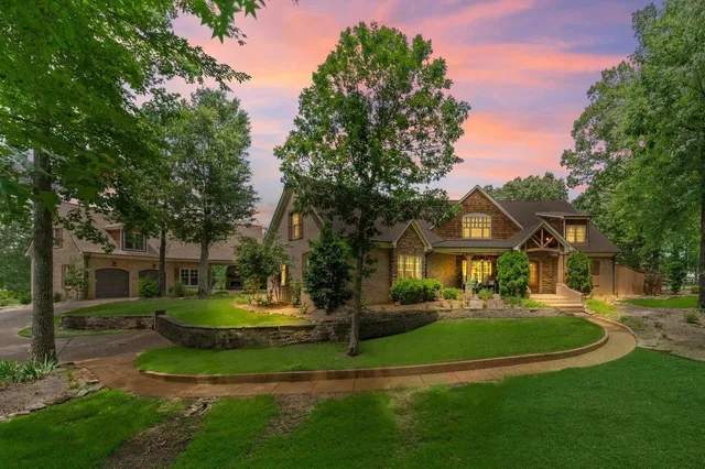 a front view of a house with a yard table and chairs