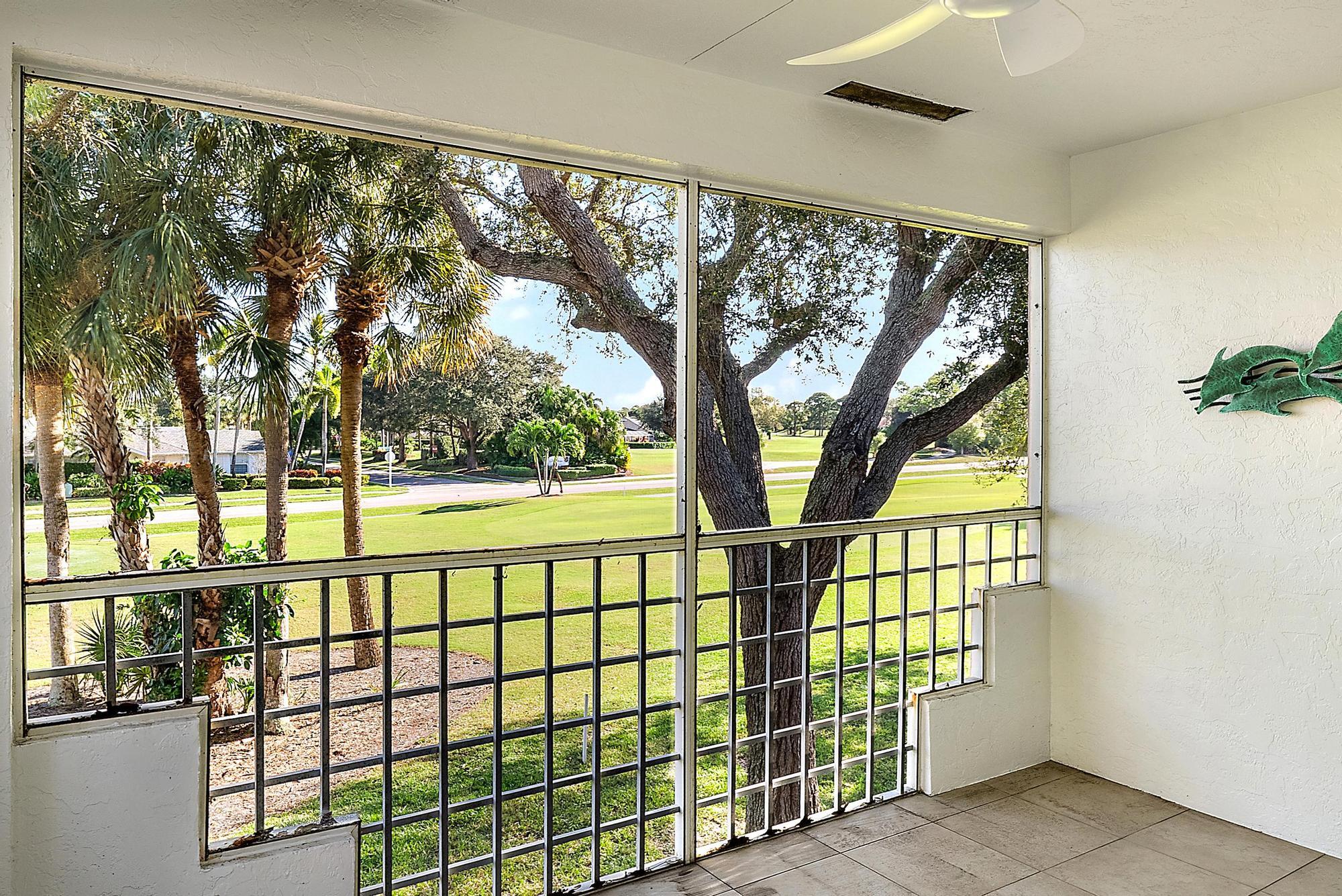 802 Muirfield Court, Unit 802A Jupiter, FL 33458 - Photo 7 of 23 Screened Patio with views of golf course