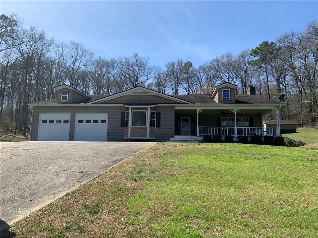 80 Collins Road Kingston, GA 30145 - Photo 1 of 1 a front view of a house with a yard and garage