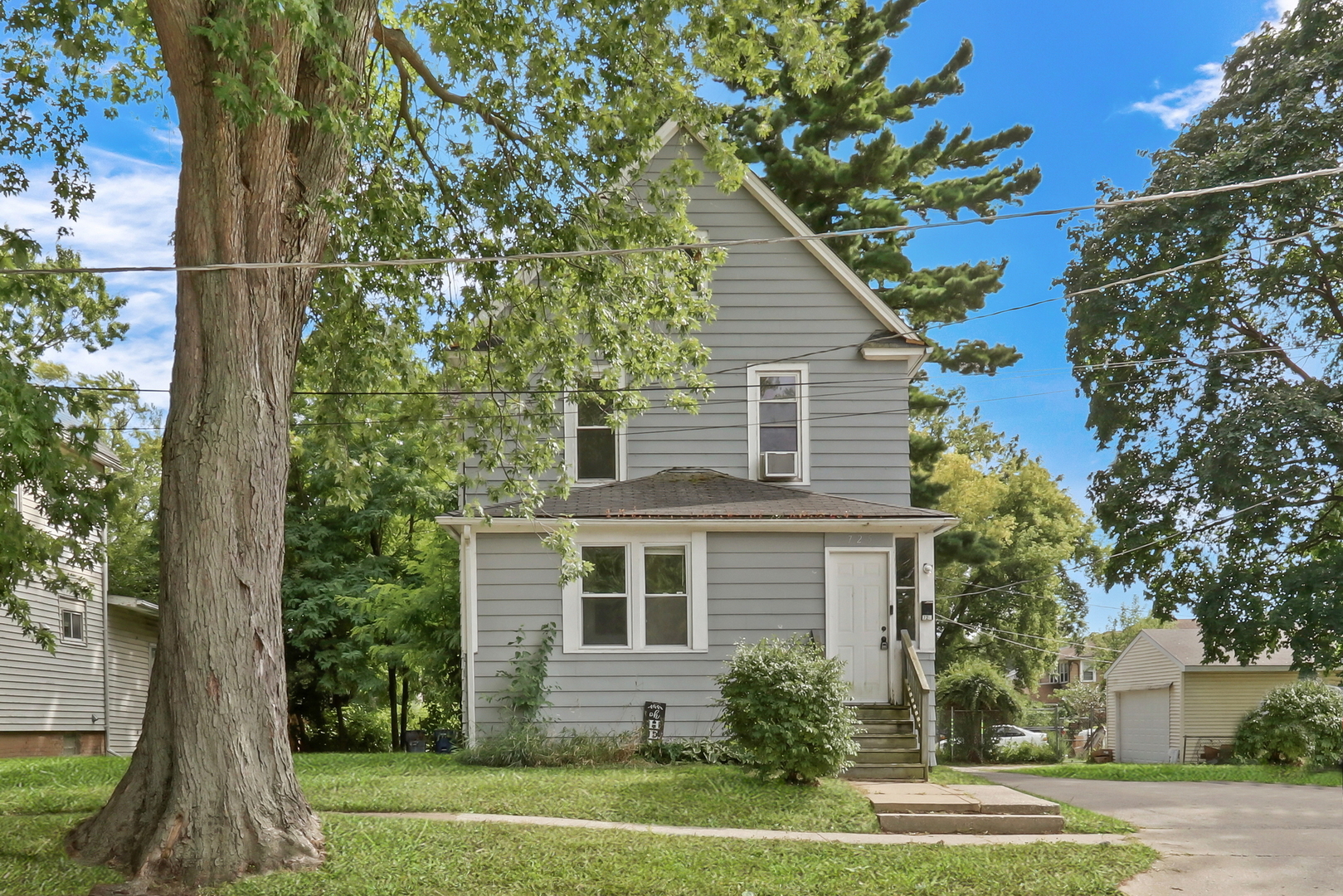 a front view of a house with a yard