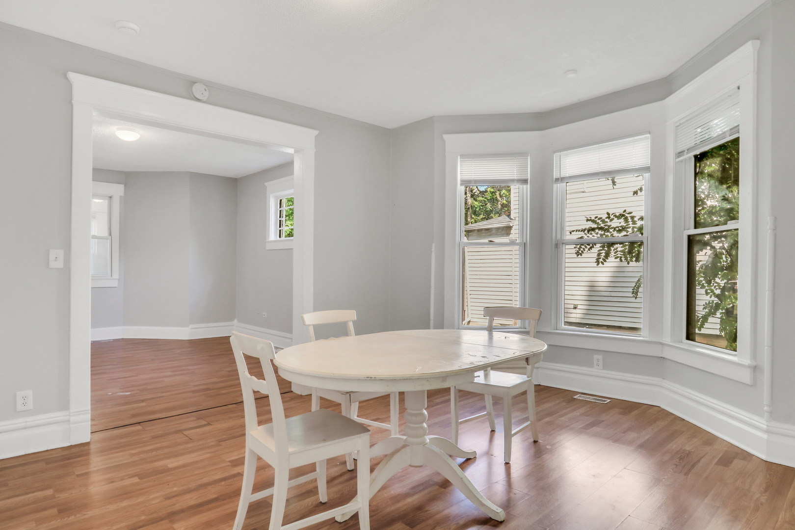 725 18th Street North Chicago, IL 60064 - Photo 11 of 32 a view of a dining room with furniture window and wooden floor