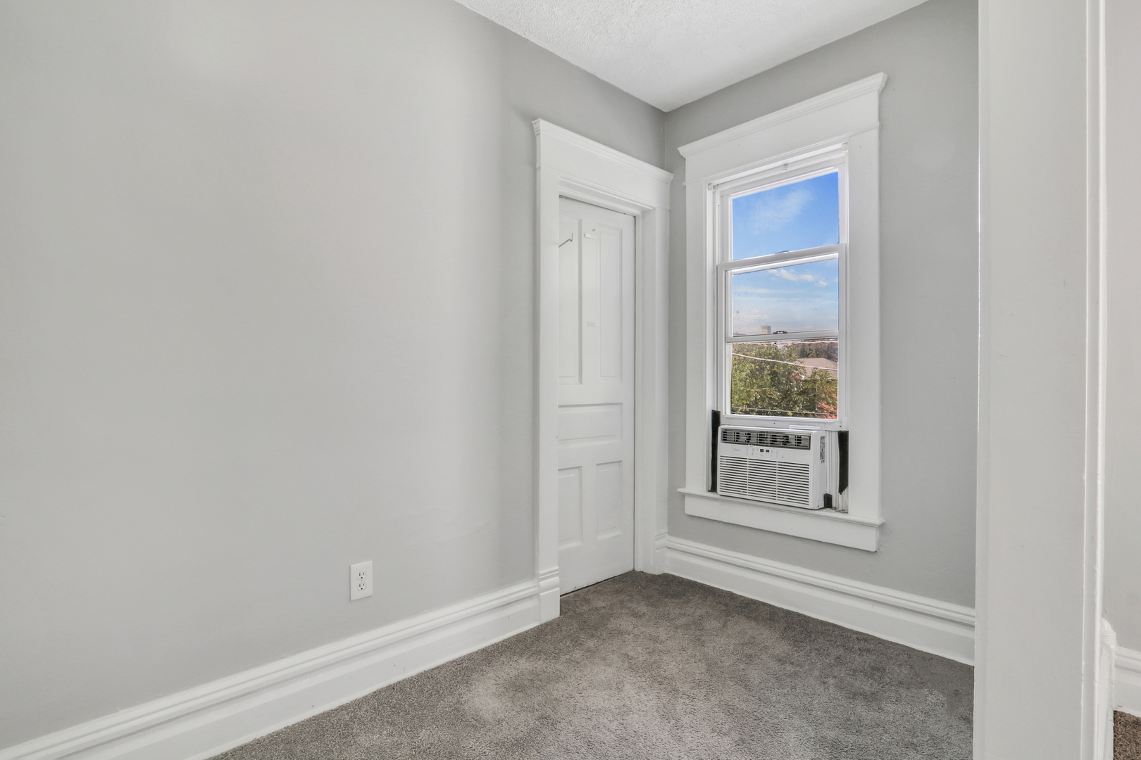 725 18th Street North Chicago, IL 60064 - Photo 21 of 32 a view of an empty room and a window