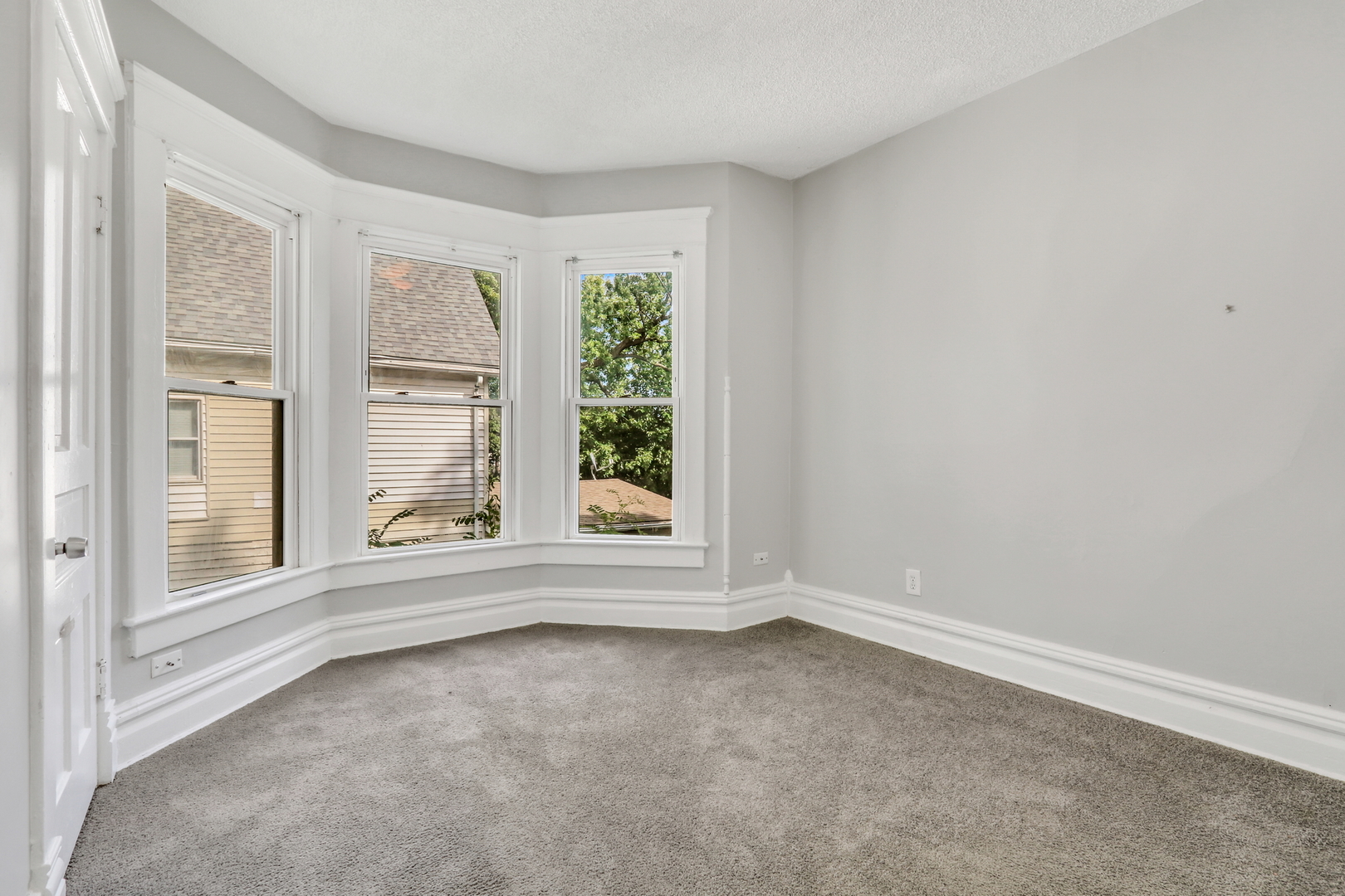 725 18th Street North Chicago, IL 60064 - Photo 23 of 32 an empty room with windows
