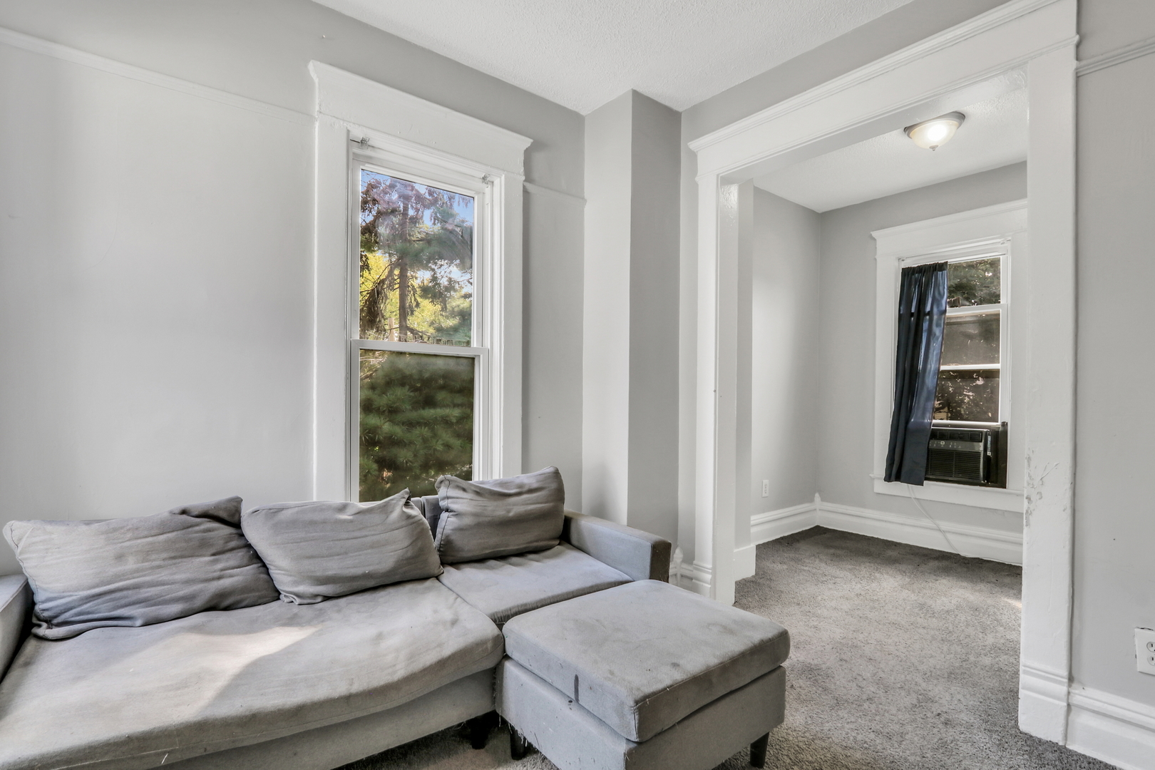 725 18th Street North Chicago, IL 60064 - Photo 26 of 32 a living room with furniture and a window