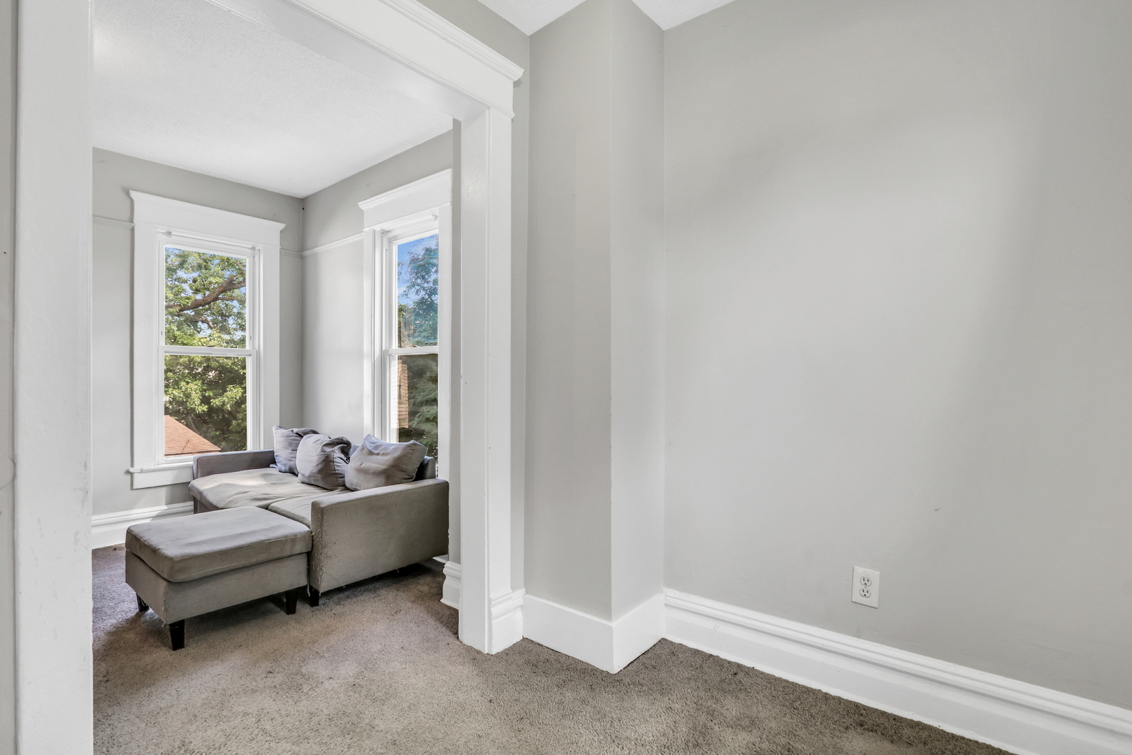 725 18th Street North Chicago, IL 60064 - Photo 28 of 32 a living room with furniture and windows
