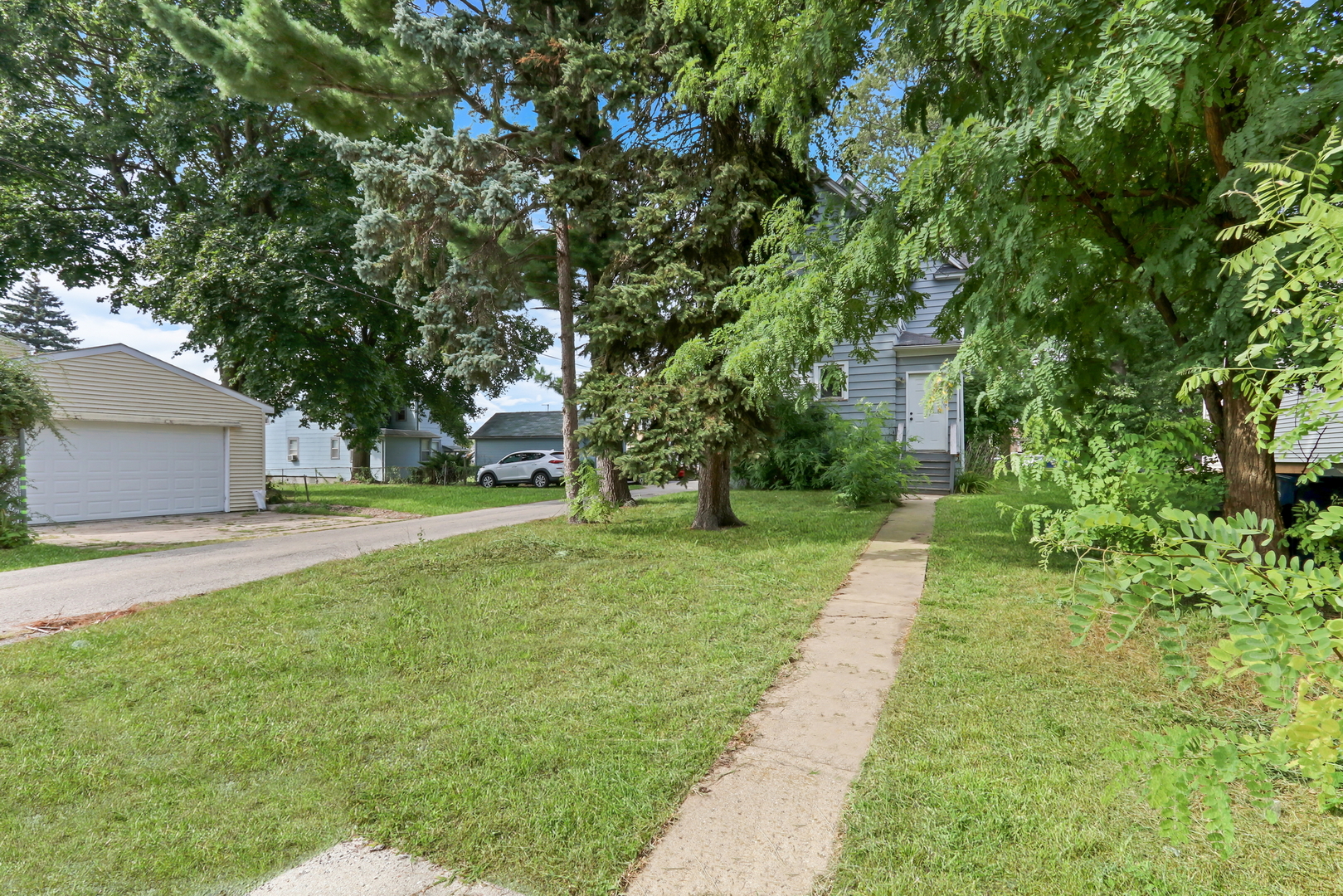 725 18th Street North Chicago, IL 60064 - Photo 31 of 32 a view of a yard with plants and a fountain