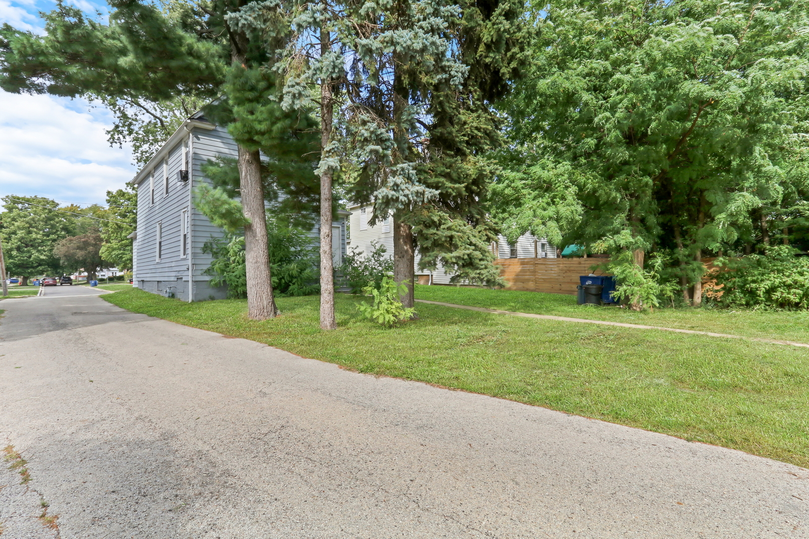 725 18th Street North Chicago, IL 60064 - Photo 32 of 32 a view of a house with a big yard and large trees