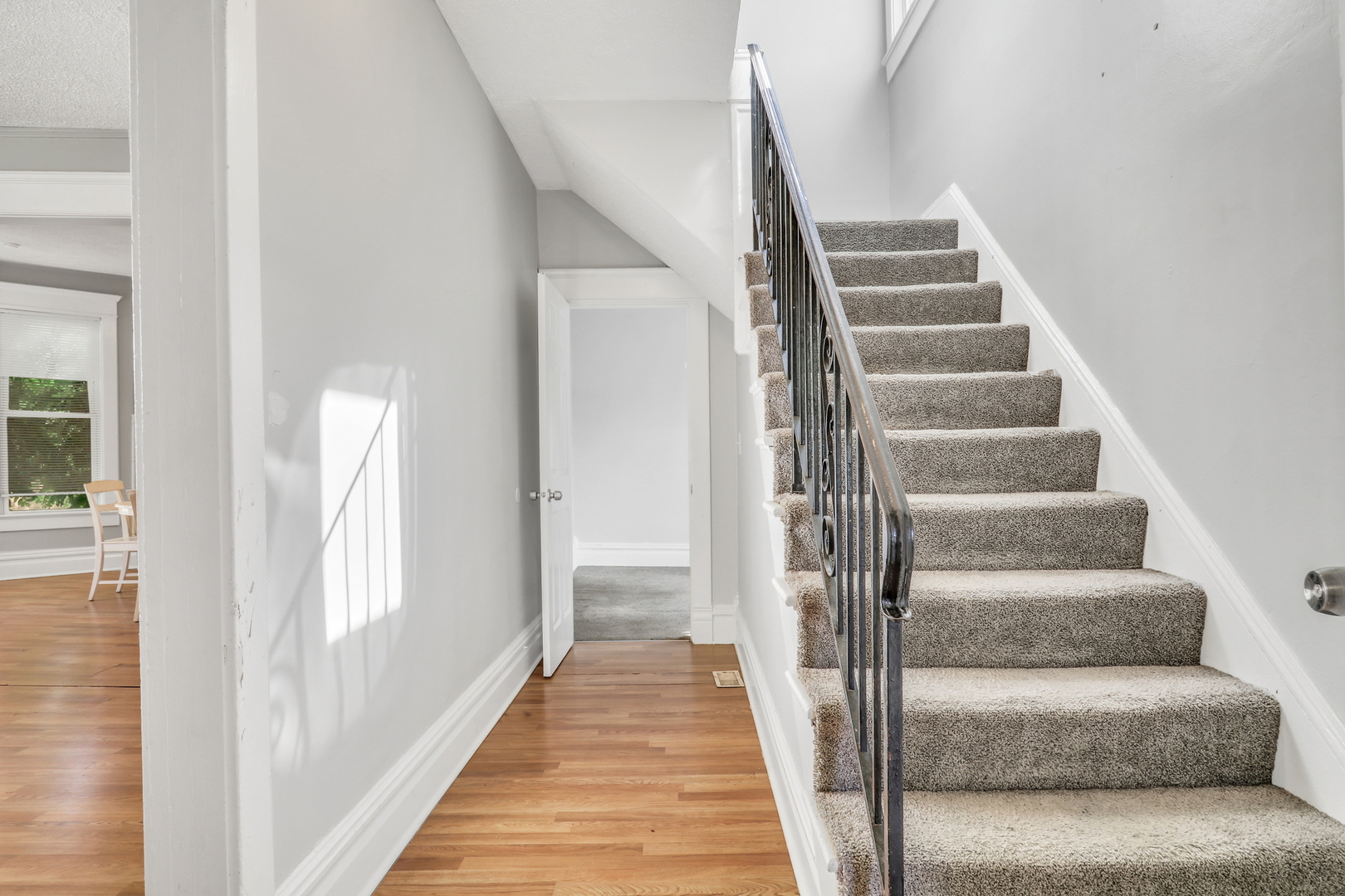 725 18th Street North Chicago, IL 60064 - Photo 5 of 32 a view of entryway and hall with wooden floor