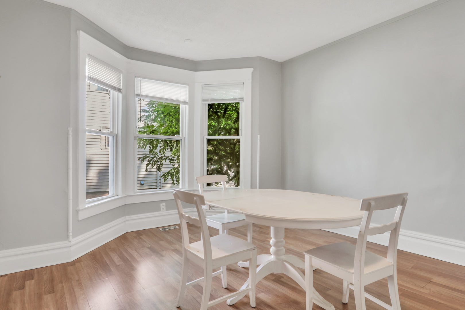 725 18th Street North Chicago, IL 60064 - Photo 10 of 32 a view of a room with furniture and wooden floor