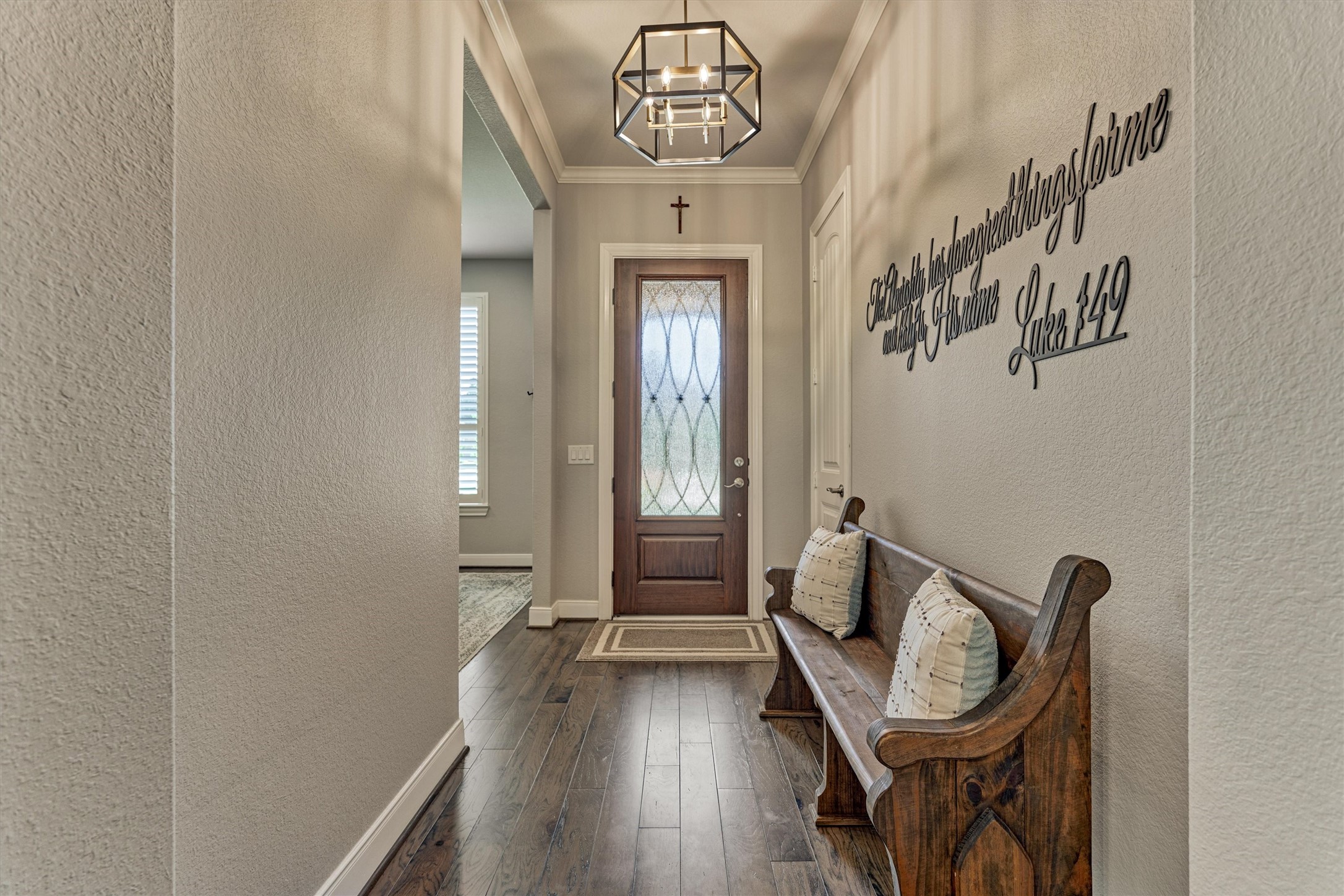 108 Wild Wick Way Spring, TX 77382 - Photo 10 of 44 A Striking 3/4 Light, All-Wood Front Door Features A Decorative And Protective Iron Grille. Several Light Fixtures Have Also Been Updated Throughout The Home.