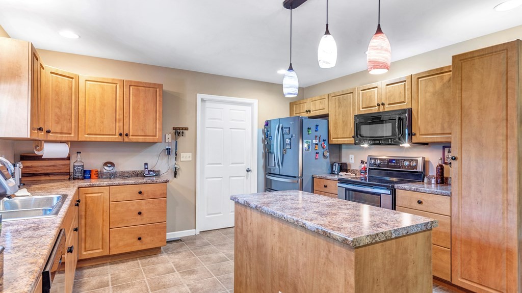 420 No Pone Valley Road Northwest Georgetown, TN 37336 - Photo 21 of 56 a kitchen with stainless steel appliances granite countertop a sink stove and refrigerator