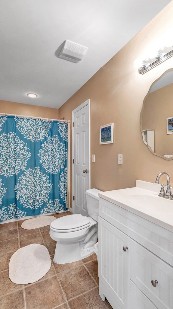 420 No Pone Valley Road Northwest Georgetown, TN 37336 - Photo 25 of 56 a bathroom with a granite countertop sink toilet a mirror and shower
