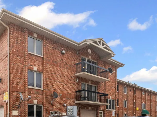 a front view of a building with balcony