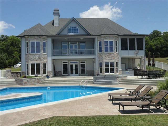 77 Cecil Johnson Road Mulberry, TN 37359 - Photo 1 of 20 a front view of a house with swimming pool