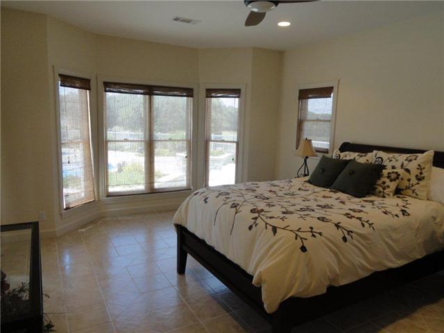 77 Cecil Johnson Road Mulberry, TN 37359 - Photo 13 of 20 a bedroom with a bed and a large window