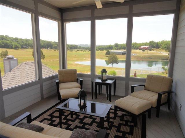 77 Cecil Johnson Road Mulberry, TN 37359 - Photo 19 of 20 a living room with furniture and floor to ceiling windows