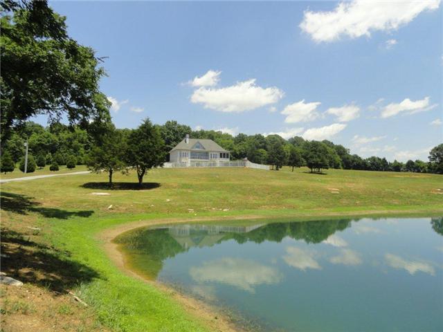 77 Cecil Johnson Road Mulberry, TN 37359 - Photo 2 of 20 a view of a lake with a big yard