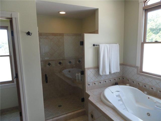 77 Cecil Johnson Road Mulberry, TN 37359 - Photo 8 of 20 a bathroom with a bathtub and a shower