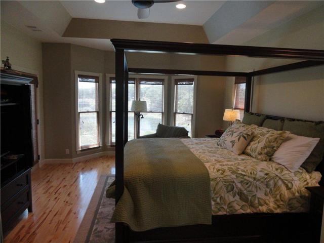 77 Cecil Johnson Road Mulberry, TN 37359 - Photo 9 of 20 a bedroom with a balcony a bed and wooden floor