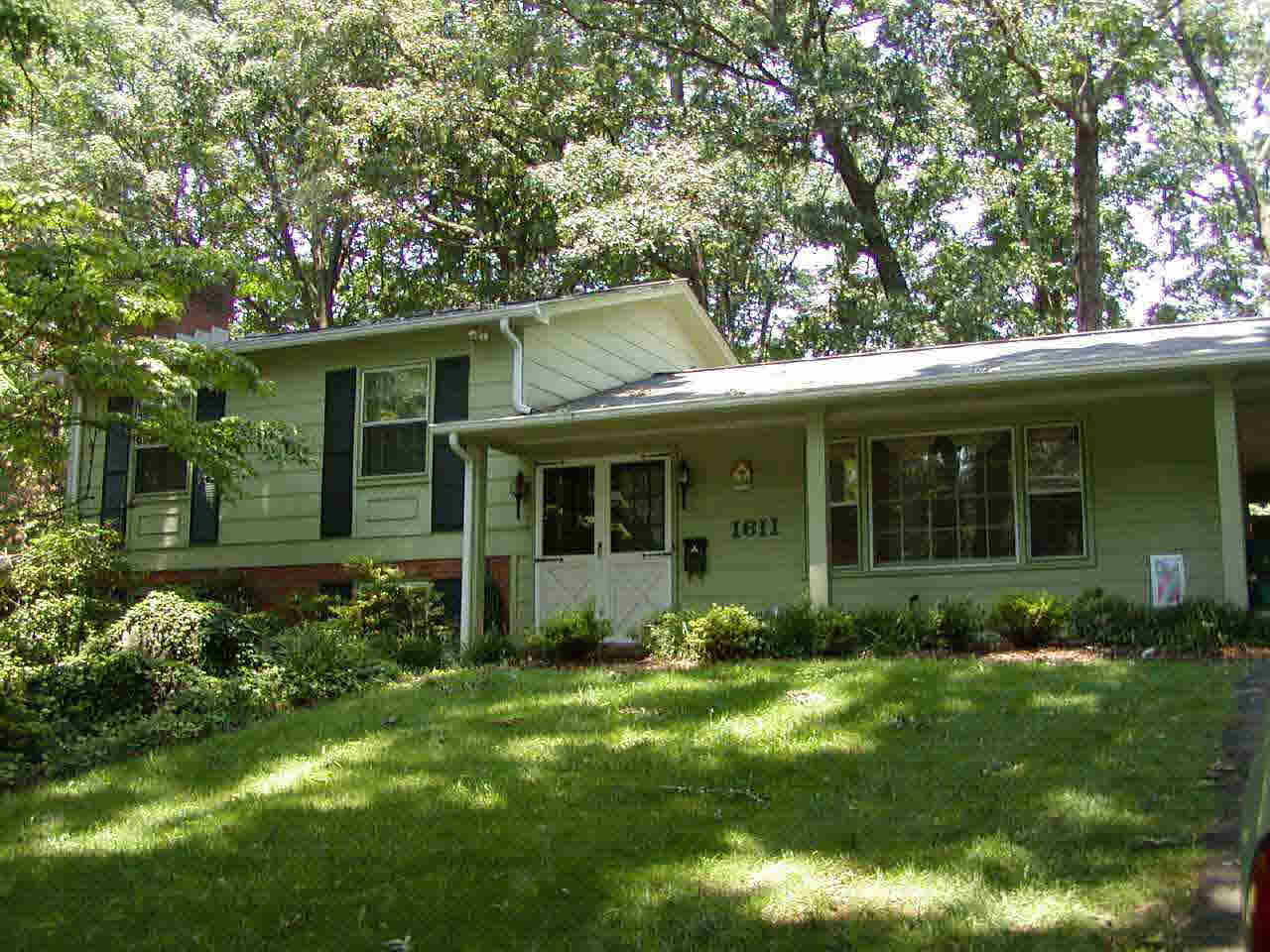1611 Trailridge Road Charlottesville, VA 22903 - Photo 1 of 1 a view of a house with a yard and plants