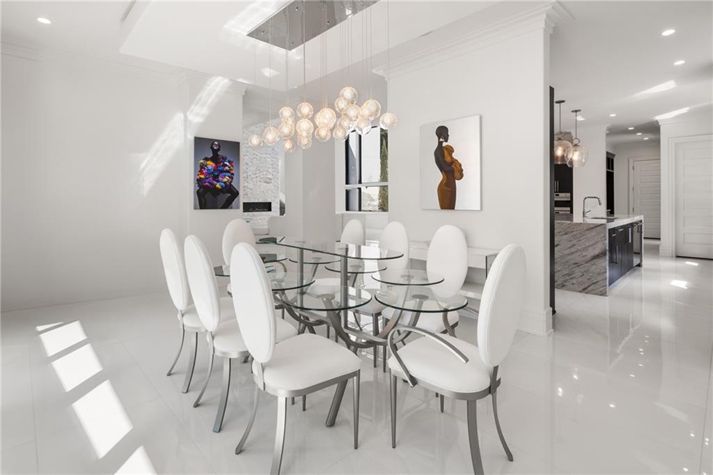 1105 Moores Mill Road Northwest Atlanta, GA 30327 - Photo 33 of 77 a view of a dining room with furniture and chandelier