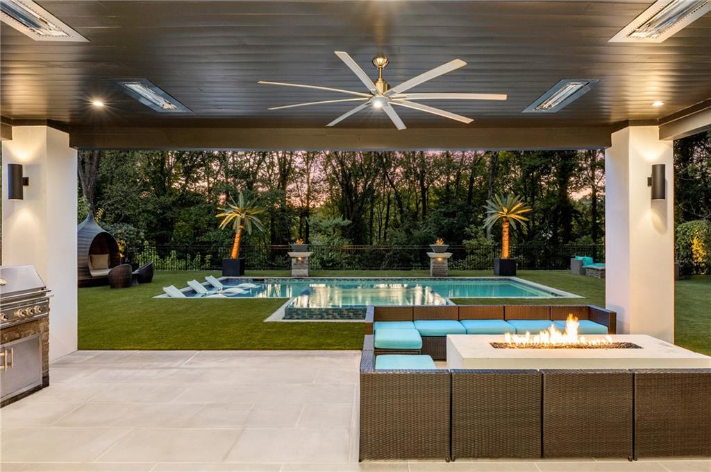 1105 Moores Mill Road Northwest Atlanta, GA 30327 - Photo 75 of 77 a view of a swimming pool with a yard