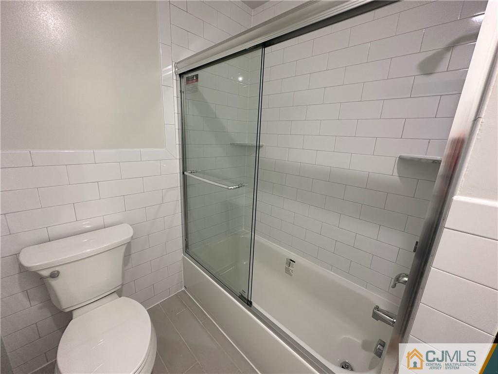 4202 Hana Road Edison, NJ 08817 - Photo 26 of 44 a bathroom with a toilet and shower