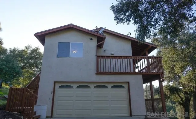 a front view of a house with balcony