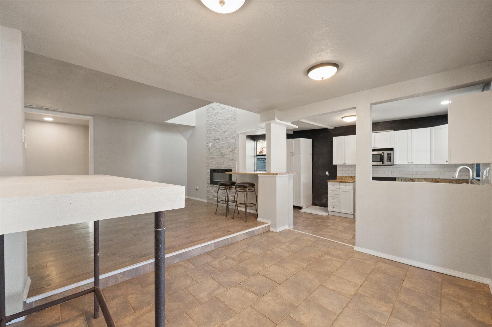 69 Pony Express Trail Lubbock, TX 79404 - Photo 26 of 39 a large kitchen with a table and chairs