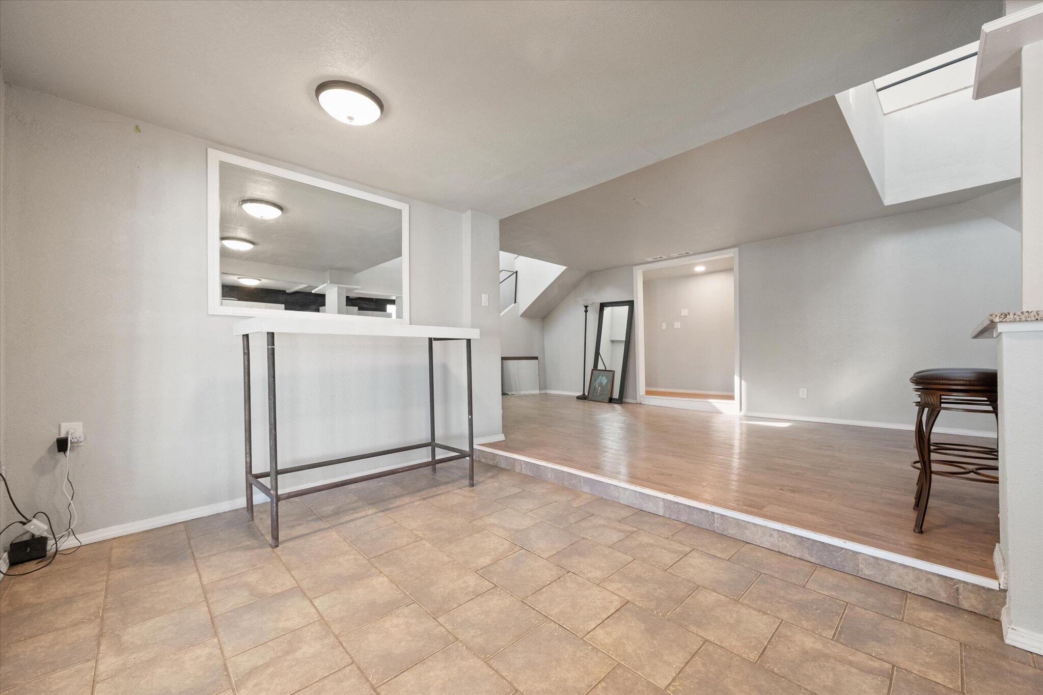 69 Pony Express Trail Lubbock, TX 79404 - Photo 8 of 39 a view of a livingroom with wooden floor and furniture