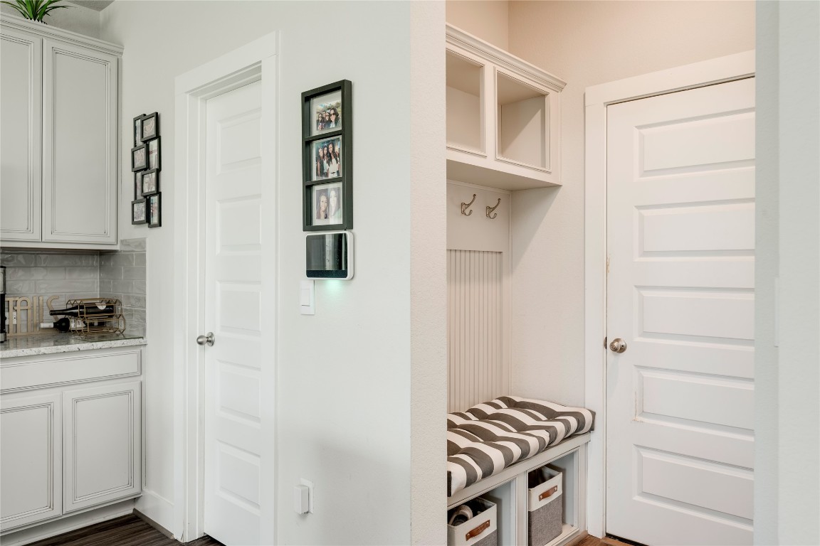 7502 Chesapeake Rail Lane, Unit 154 Austin, TX 78744 - Photo 16 of 40 a kitchen with white cabinets and white appliances