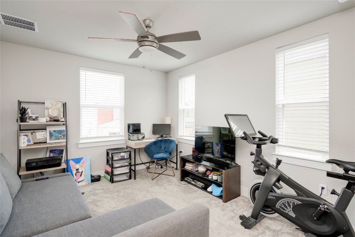 7502 Chesapeake Rail Lane, Unit 154 Austin, TX 78744 - Photo 28 of 40 a view of a workspace with furniture and a window