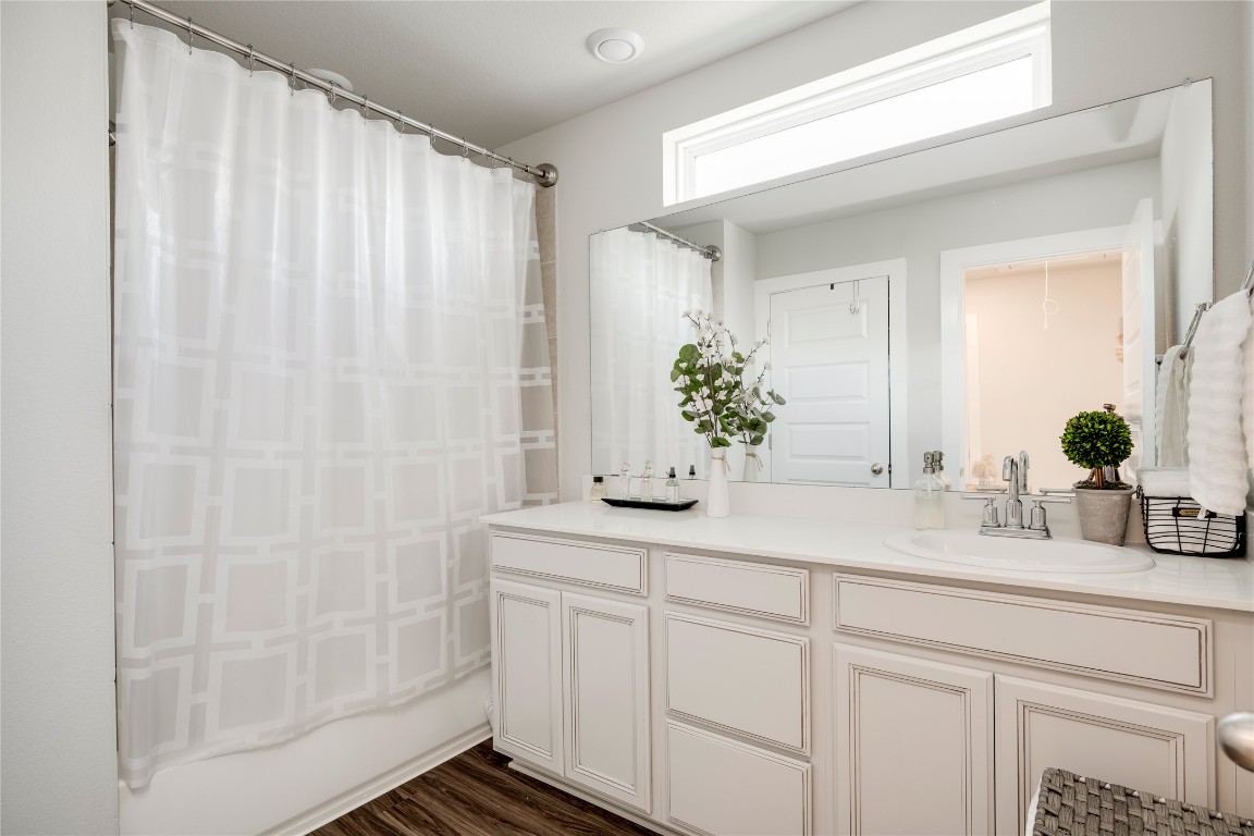 7502 Chesapeake Rail Lane, Unit 154 Austin, TX 78744 - Photo 30 of 40 a bathroom with a sink and a mirror