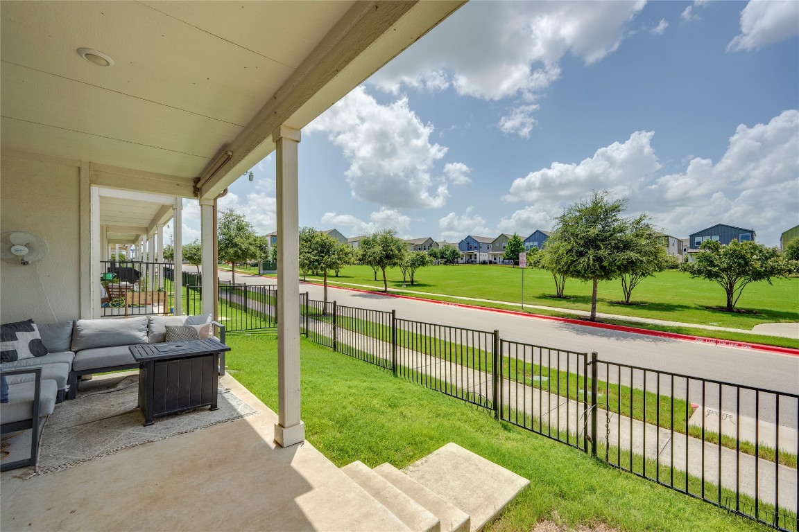 7502 Chesapeake Rail Lane, Unit 154 Austin, TX 78744 - Photo 32 of 40 a view of a garden and trees in the background