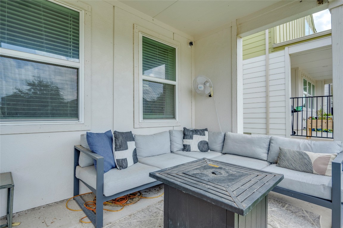 7502 Chesapeake Rail Lane, Unit 154 Austin, TX 78744 - Photo 35 of 40 a living room with furniture and a window