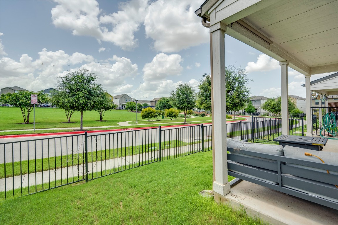 7502 Chesapeake Rail Lane, Unit 154 Austin, TX 78744 - Photo 36 of 40 a view of a porch with a yard