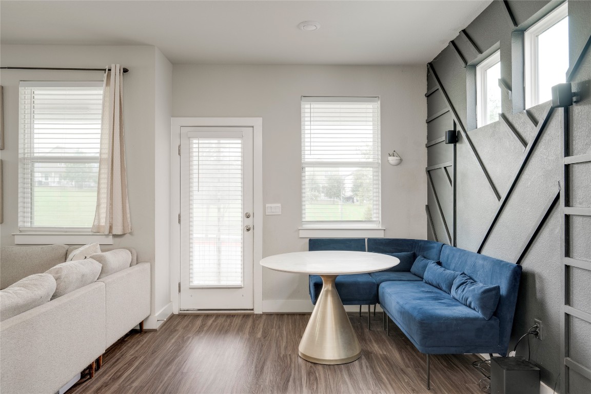 7502 Chesapeake Rail Lane, Unit 154 Austin, TX 78744 - Photo 10 of 40 a living room with furniture and a large window