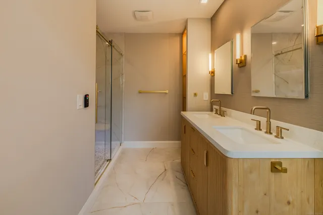 a white toilet sitting next to a bathroom sink