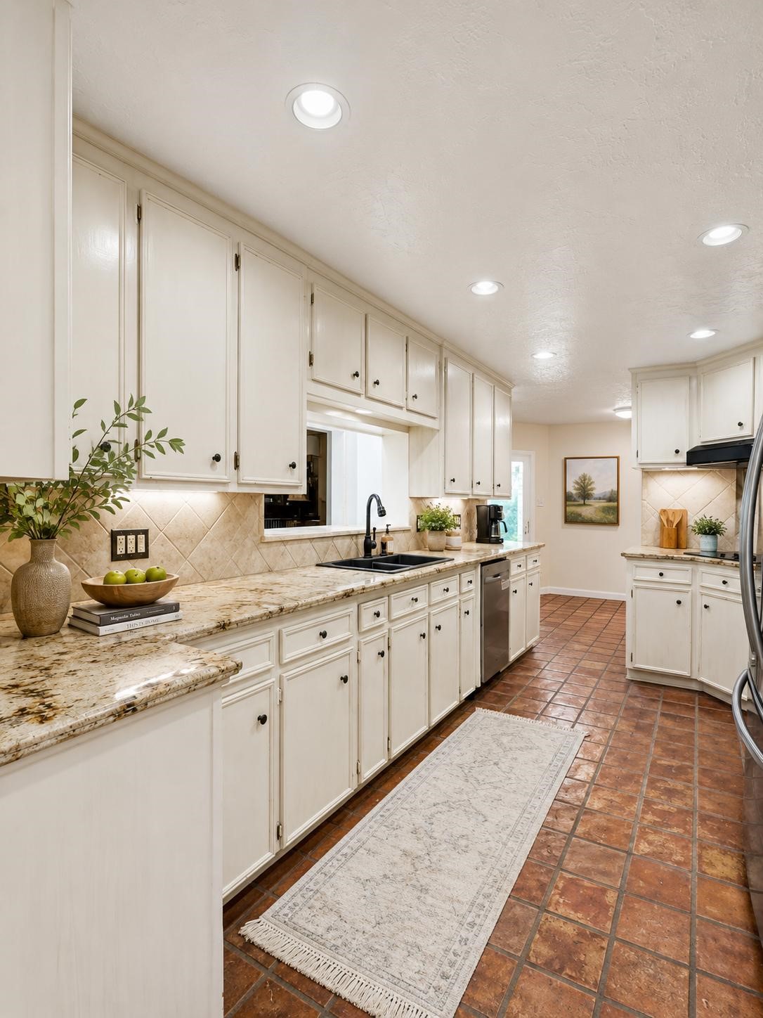 6514 Misty Springs Lane Spring, TX 77379 - Photo 6 of 49 a large kitchen with kitchen island sink stove and white cabinets