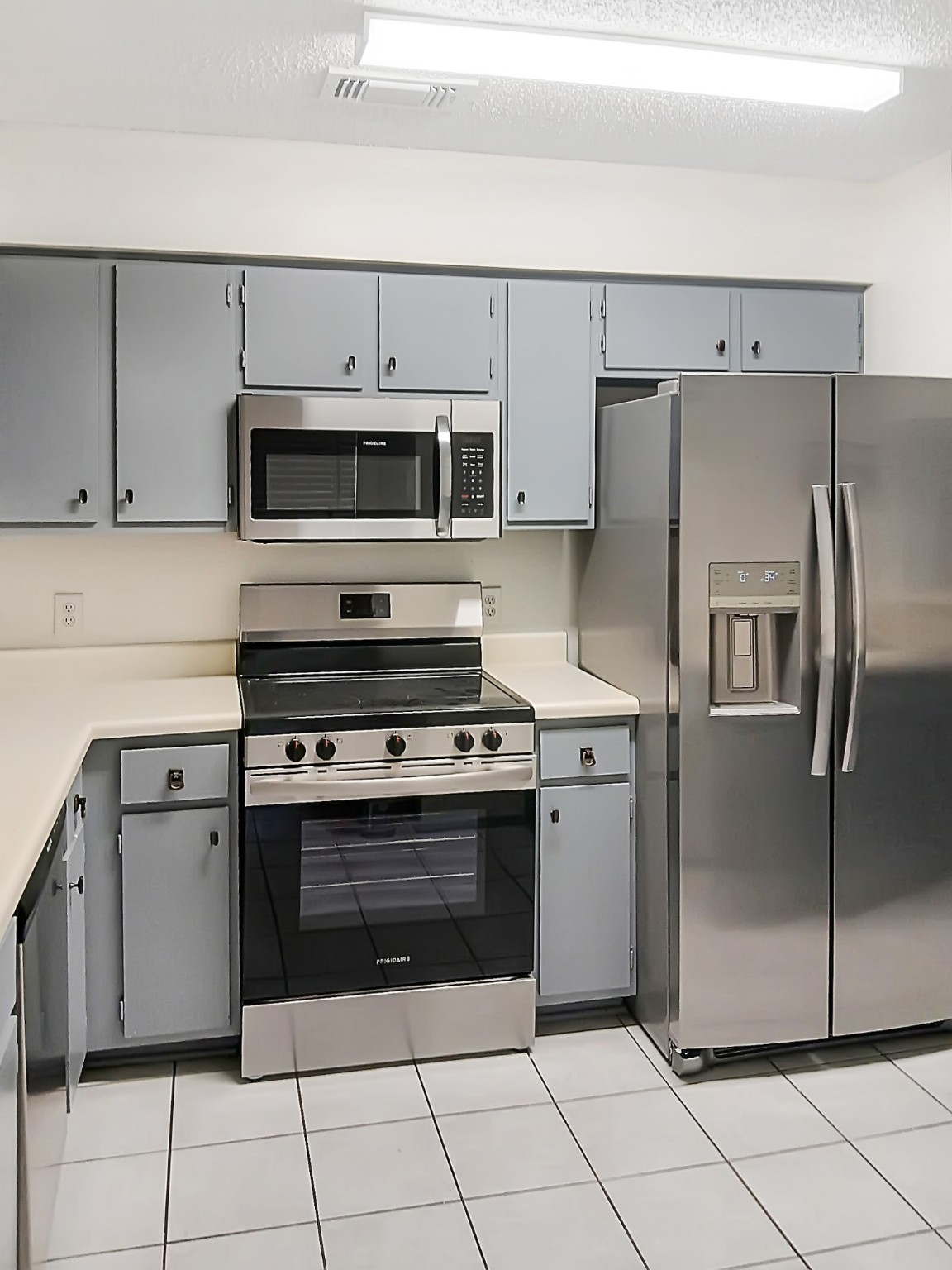 6601 Sands Point Drive, Unit 5 Houston, TX 77074 - Photo 3 of 6 a kitchen with cabinets stainless steel appliances and a counter space