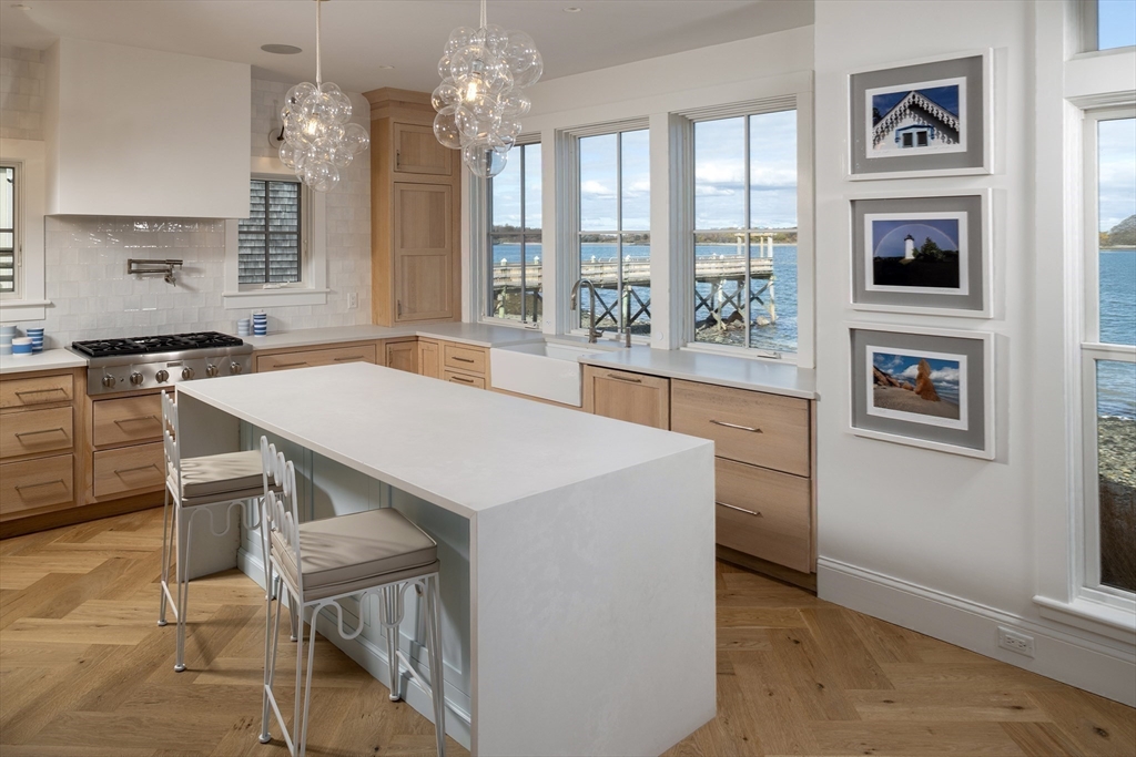93 Kimball Beach Road Hingham, MA 02043 - Photo 6 of 36 a kitchen that has a table and chairs in it