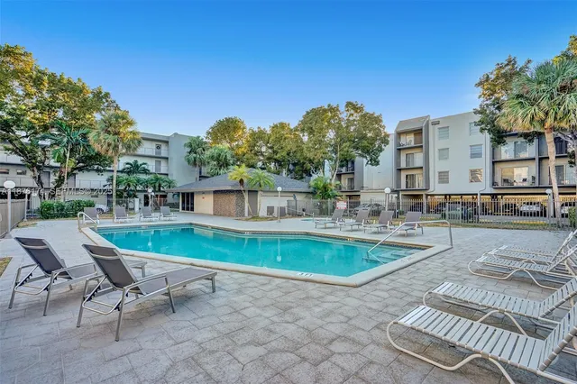 a view of a patio with swimming pool